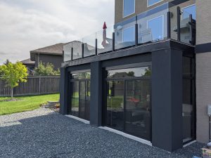 Curtain wall enclosures are perfectly suited for walk out basements
